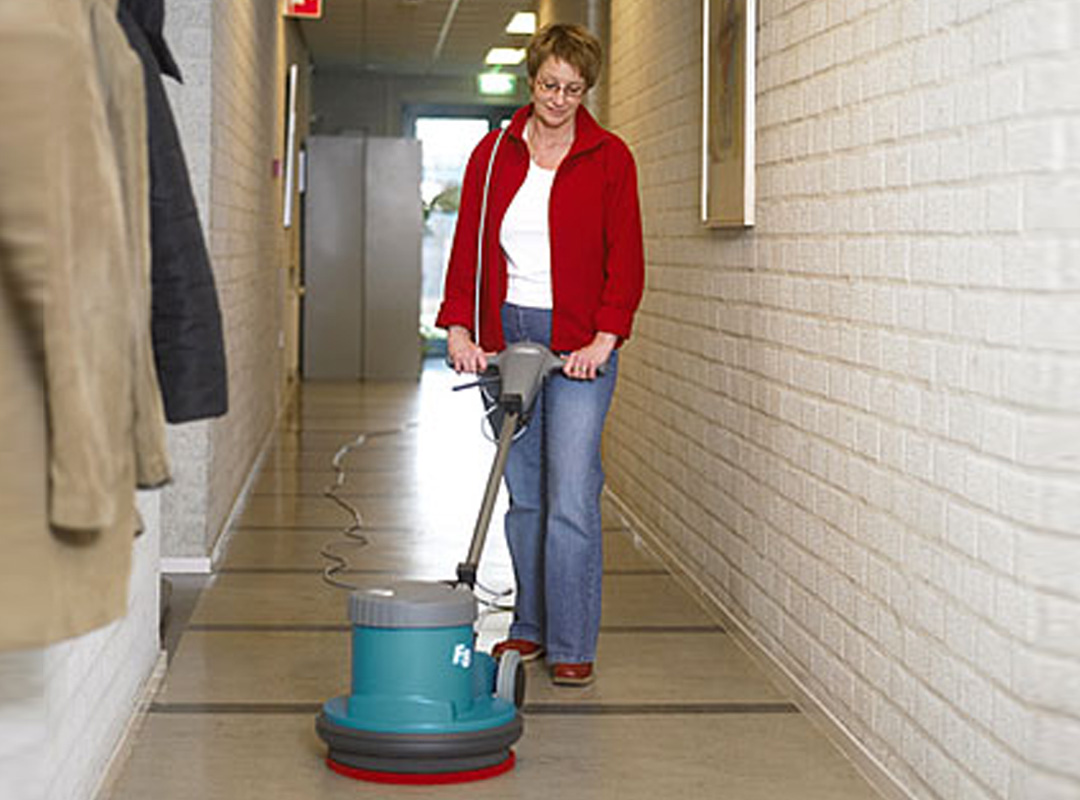 Person using a Brush and Broom Burnisher