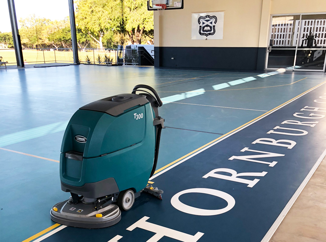 Brush and Broom Floor Scrubber Machine being used in a buidling